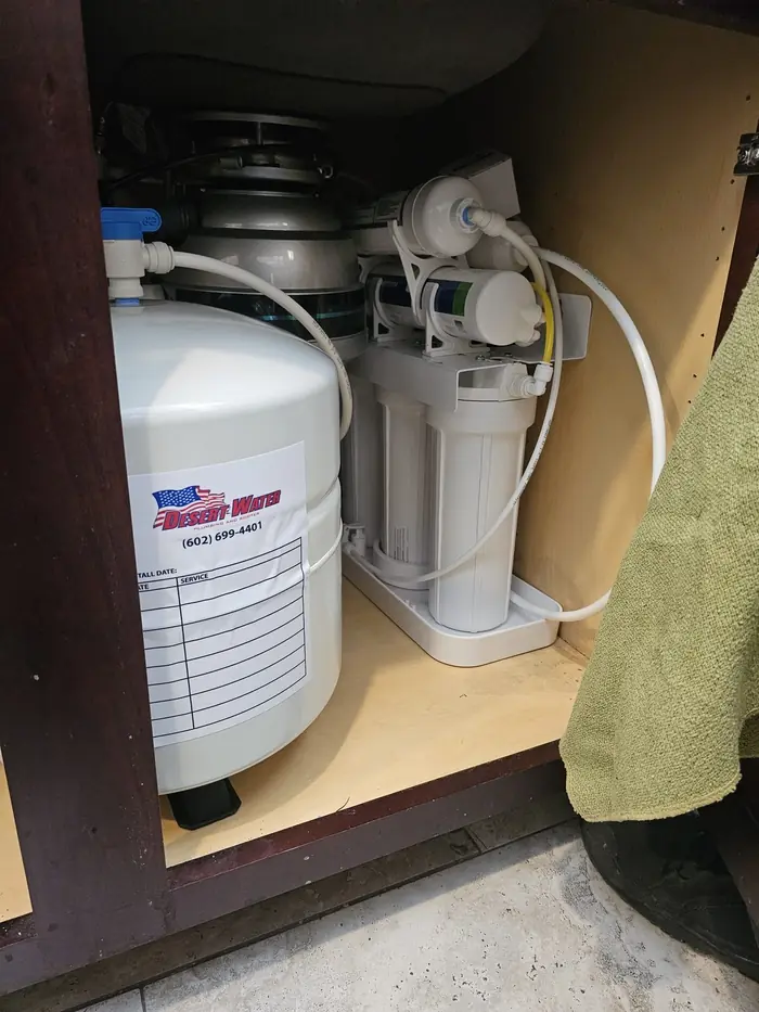 Reverse osmosis system installed under a kitchen sink
